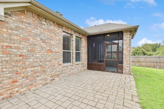 view of patio with a sunroom