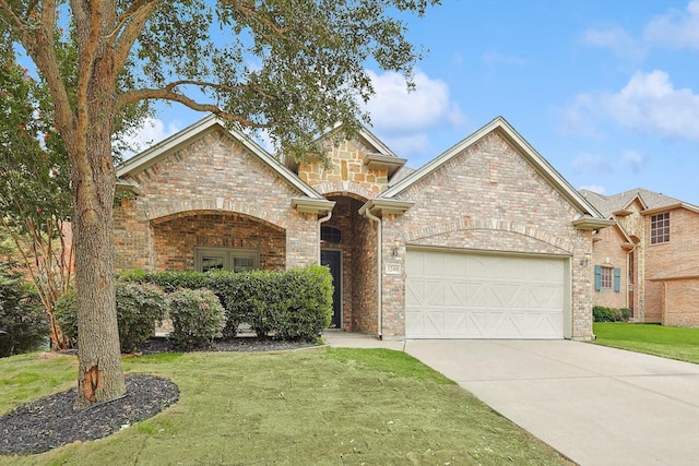 view of front of house with a garage and a front lawn