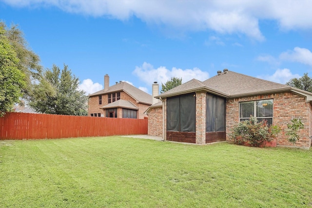 view of yard featuring a sunroom