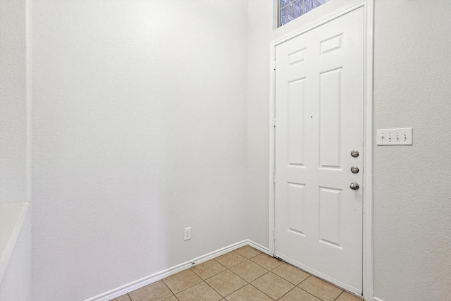 entrance foyer featuring light tile patterned floors