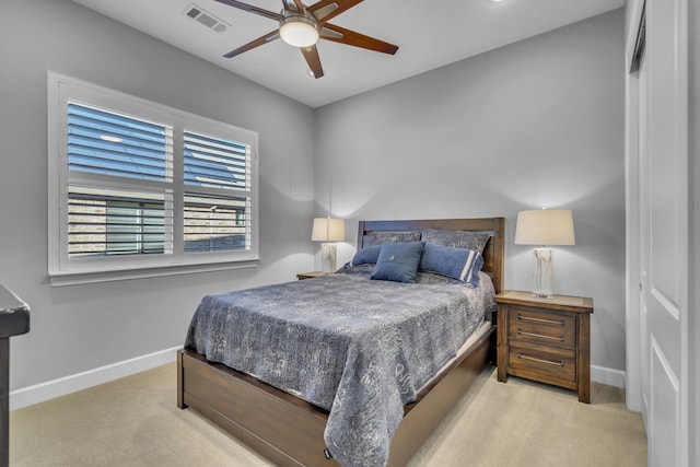 bedroom with light colored carpet and ceiling fan