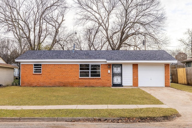 single story home with a garage and a front lawn