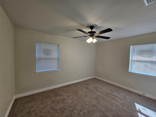 carpeted empty room featuring ceiling fan