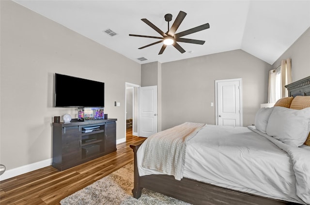 bedroom with ceiling fan, lofted ceiling, and dark hardwood / wood-style flooring