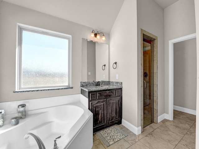 bathroom featuring vanity and shower with separate bathtub