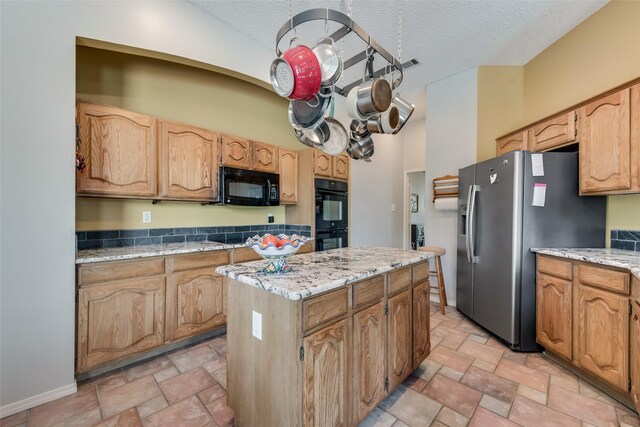 entrance foyer with ceiling fan with notable chandelier, a fireplace, and light parquet floors