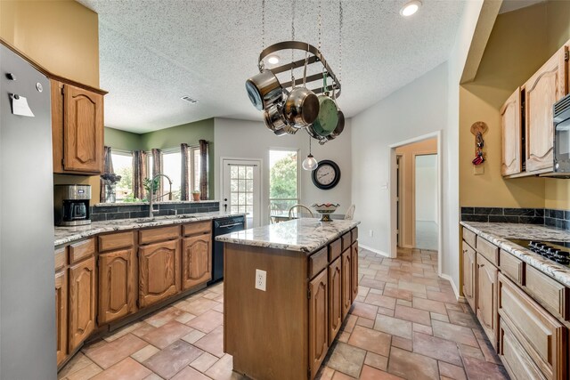 office area with ceiling fan, light parquet flooring, a fireplace, and a textured ceiling