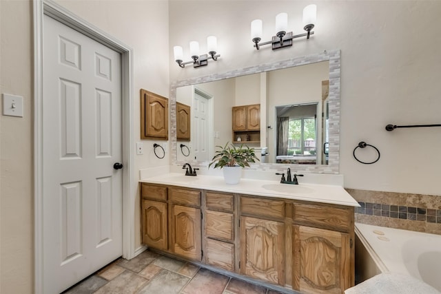 bathroom with vanity and a bathtub