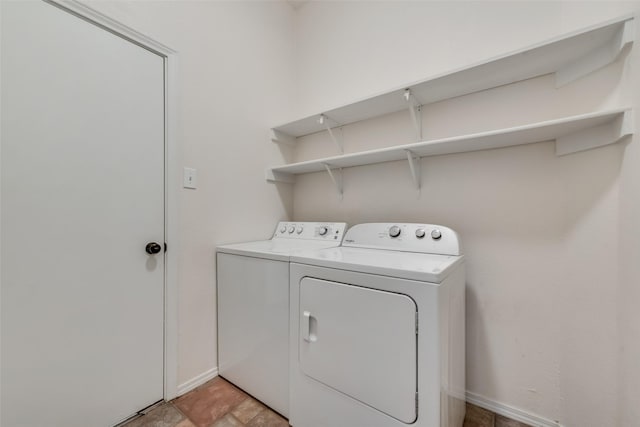 washroom featuring washing machine and dryer