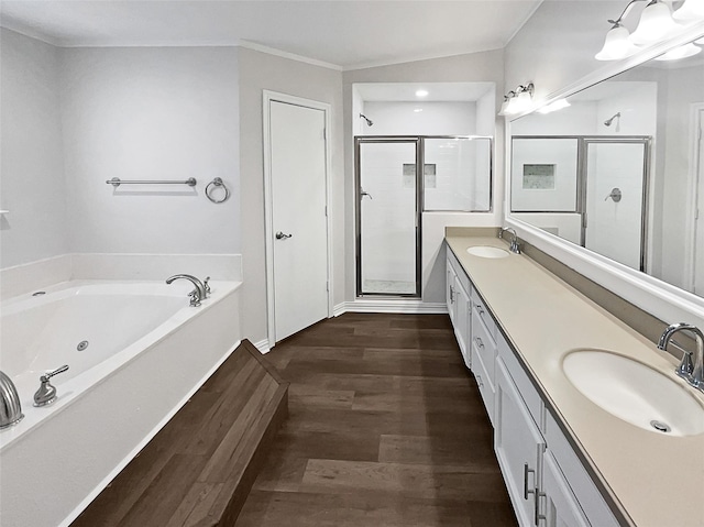 bathroom featuring shower with separate bathtub, hardwood / wood-style floors, and vanity