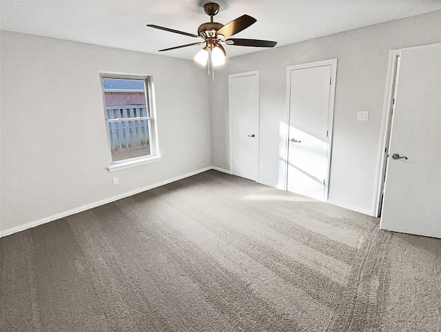 unfurnished bedroom featuring carpet and ceiling fan