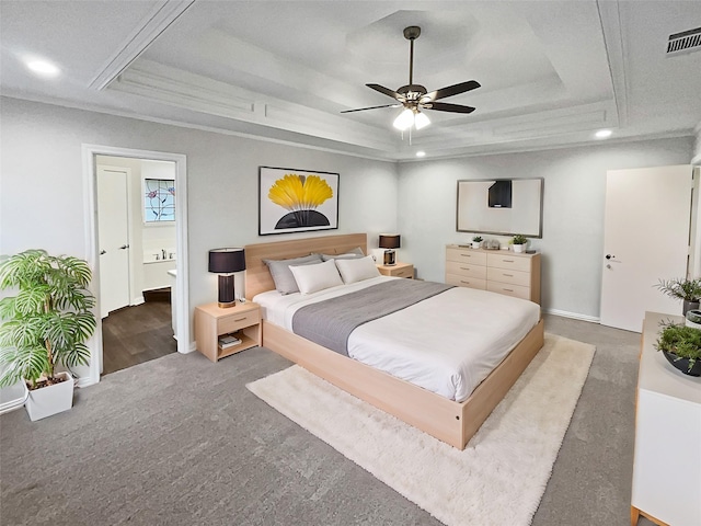 bedroom featuring crown molding, ceiling fan, a tray ceiling, and carpet