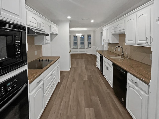 kitchen featuring white cabinetry, sink, dark hardwood / wood-style floors, and black appliances