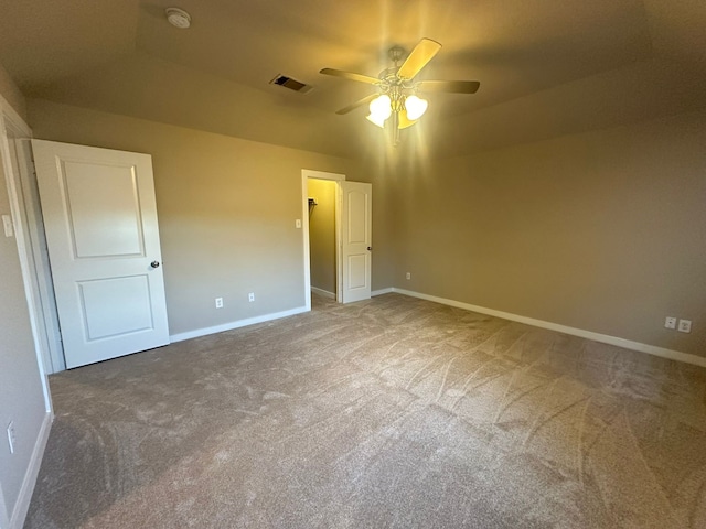 unfurnished bedroom with carpet floors and ceiling fan