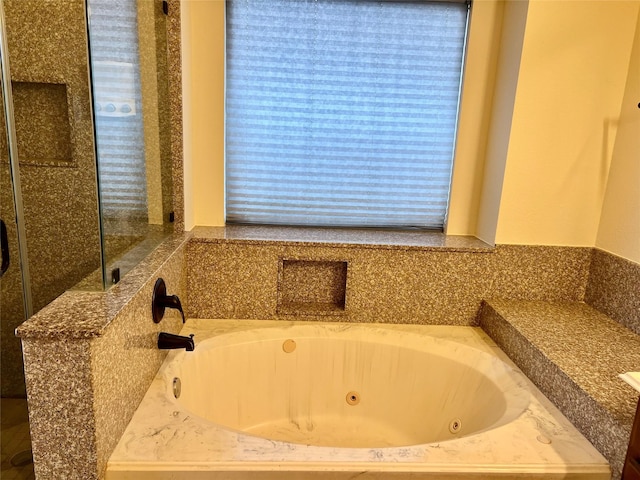 full bath featuring a jetted tub