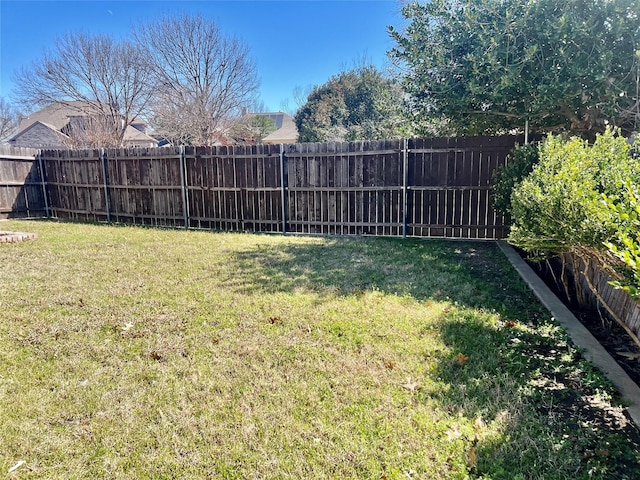 view of yard featuring a fenced backyard