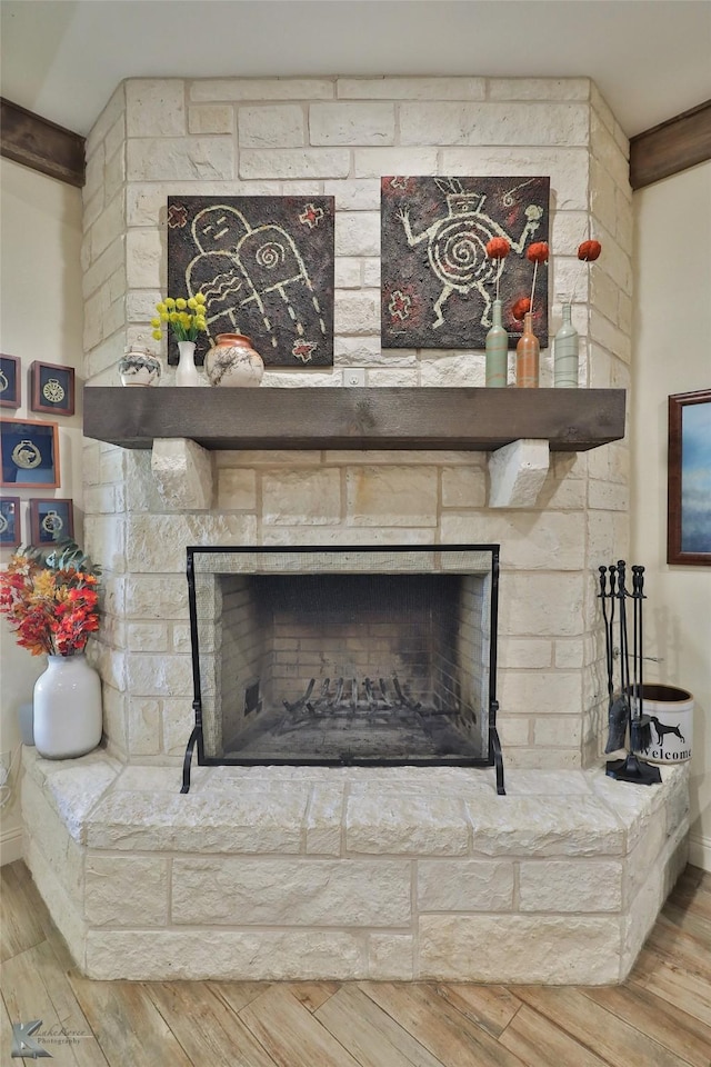 interior details with hardwood / wood-style floors and a fireplace