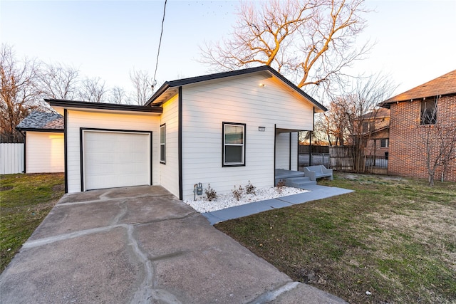 view of front facade with a garage and a front lawn