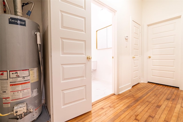 utility room featuring water heater