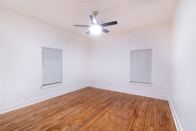 empty room featuring ceiling fan and wood-type flooring