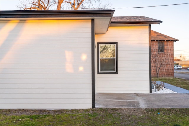 view of property exterior with a patio area