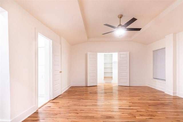 interior space featuring ceiling fan, light hardwood / wood-style floors, and vaulted ceiling