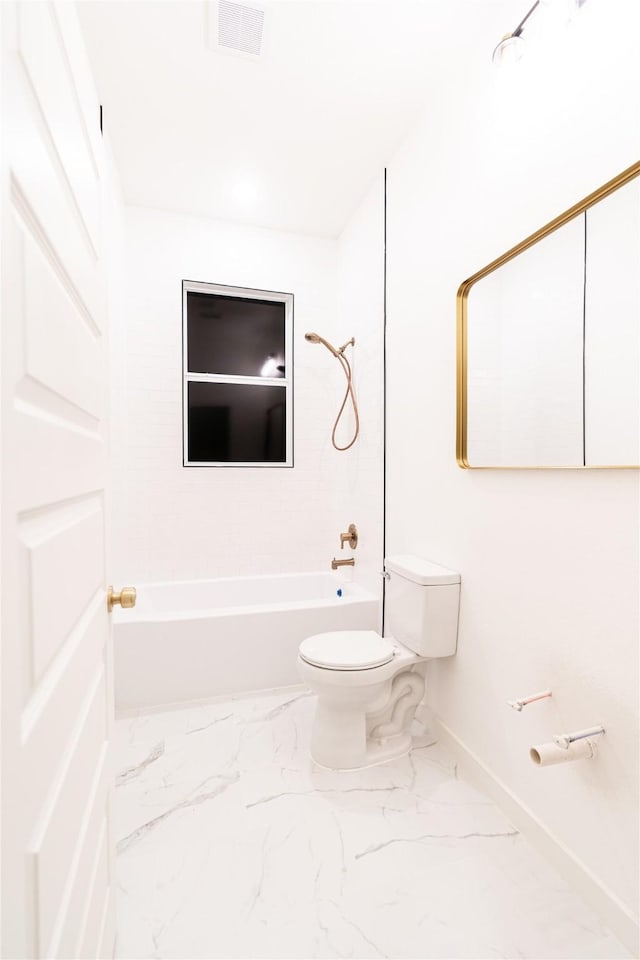 bathroom featuring toilet and bathtub / shower combination