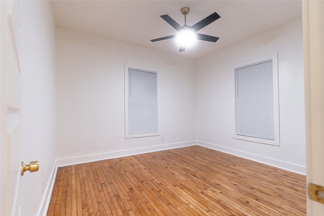 spare room with light hardwood / wood-style floors and ceiling fan