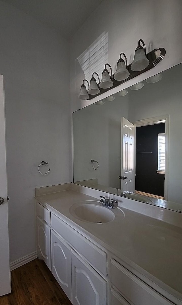 bathroom featuring vanity and hardwood / wood-style floors