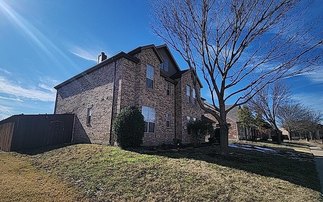 view of property exterior with a lawn