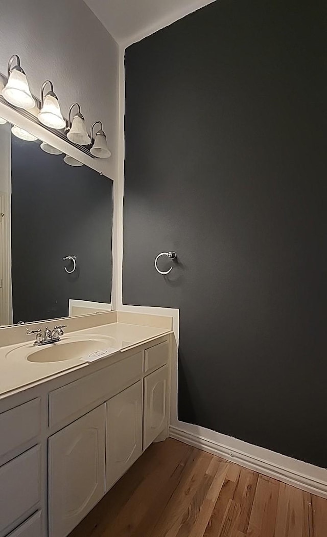 bathroom featuring hardwood / wood-style flooring and vanity