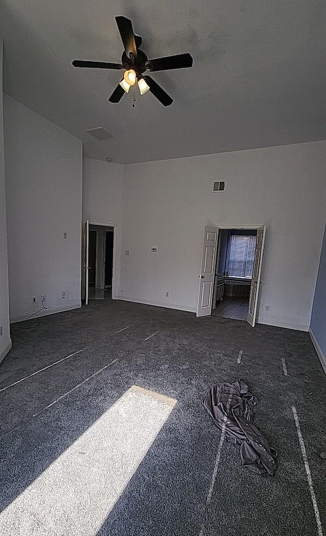 unfurnished living room with ceiling fan