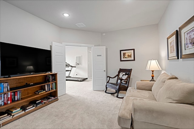 carpeted living room featuring recessed lighting and visible vents