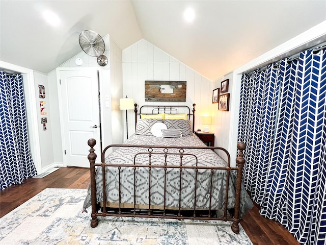 bedroom featuring hardwood / wood-style flooring and lofted ceiling