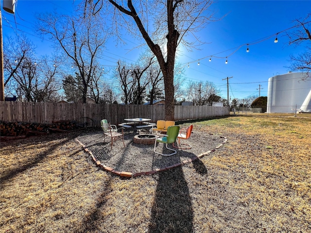 view of yard with an outdoor fire pit