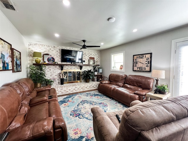 living room featuring a wealth of natural light and ceiling fan