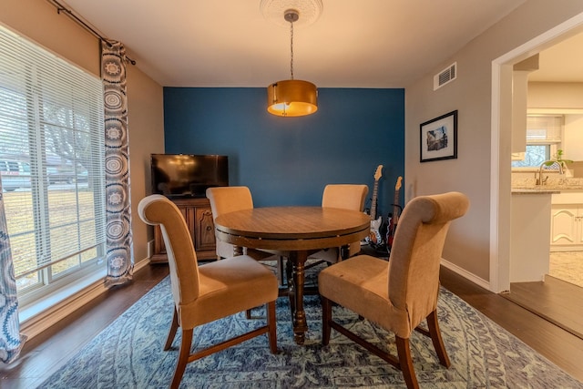 dining space featuring dark hardwood / wood-style floors