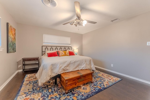 bedroom with ceiling fan and dark hardwood / wood-style flooring