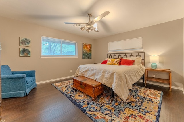 bedroom with dark wood-type flooring and ceiling fan