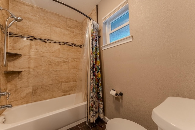 bathroom featuring shower / bath combo and toilet