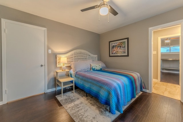 bedroom featuring dark hardwood / wood-style floors and ceiling fan