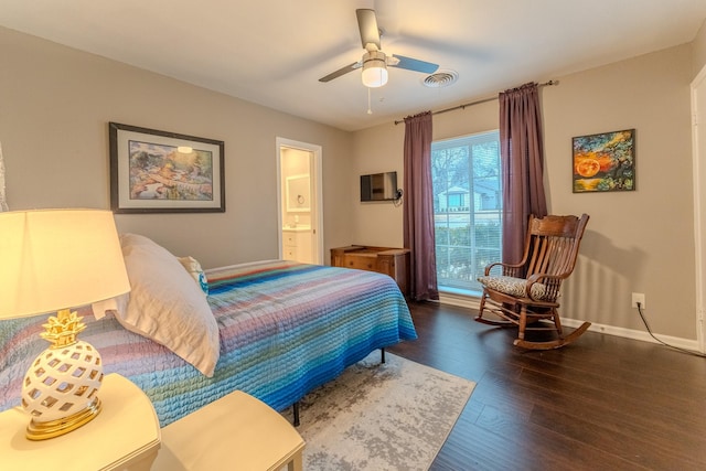 bedroom with dark wood-type flooring, connected bathroom, and ceiling fan