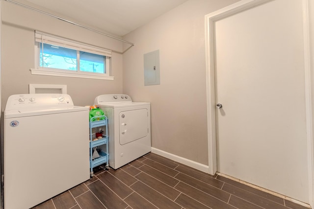 washroom with washing machine and clothes dryer and electric panel