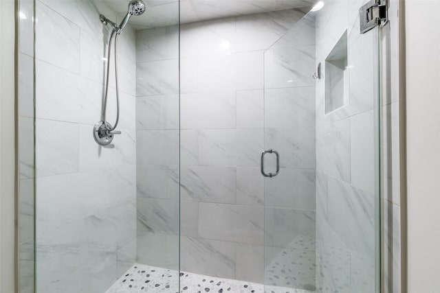 bathroom with a shower with shower door