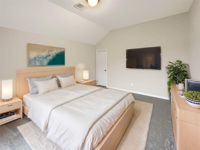 carpeted bedroom with vaulted ceiling