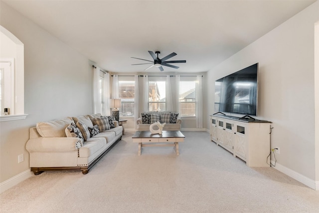 living room with ceiling fan and light colored carpet