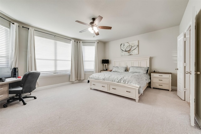 bedroom with light carpet and ceiling fan