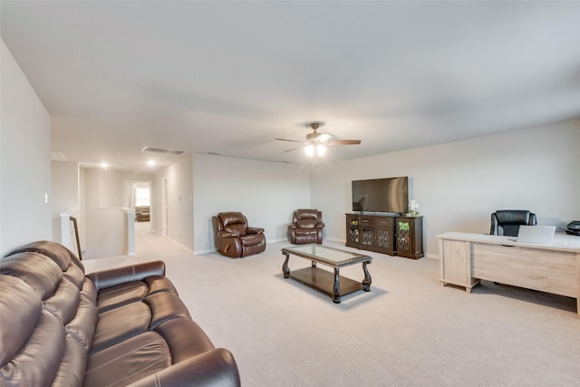 carpeted living room featuring ceiling fan