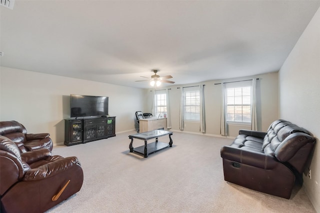 living room with ceiling fan and carpet floors