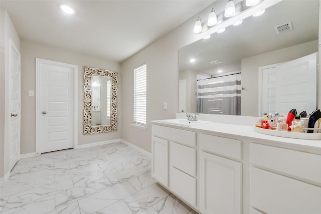 bathroom featuring vanity and a shower with shower curtain